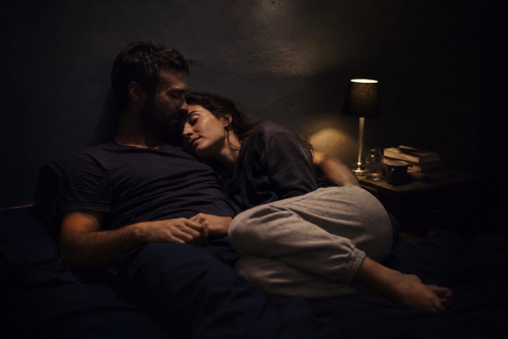 A couple practicing the karezza method, sustained intimacy without orgasm, in a calm and present connection